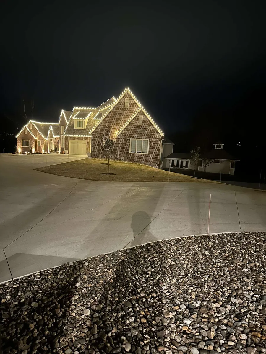 Christmas light install cut to the roofline of a Clive residence